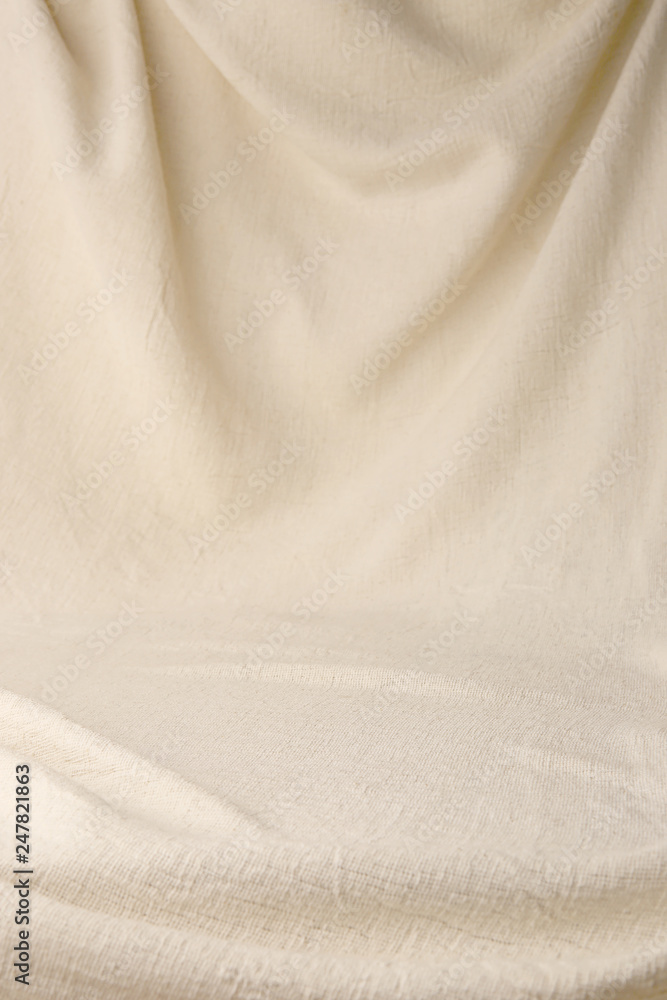 Abstract drapery cloth background. Beige woven textile drape with empty place. Abstract drapery cloth background. Beige woven textile drape with empty place.