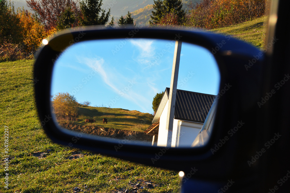 Beautiful view of the Carpathians in the car mirror Beautiful view of the Carpathians in the car mirror