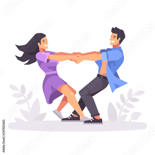 Romantic young couple holing hands and spinning around, forming a heart shape