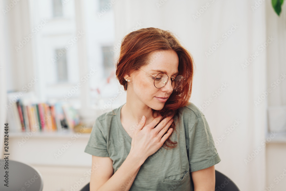 Serene young woman enjoying a quiet moment Serene young woman enjoying a quiet moment
