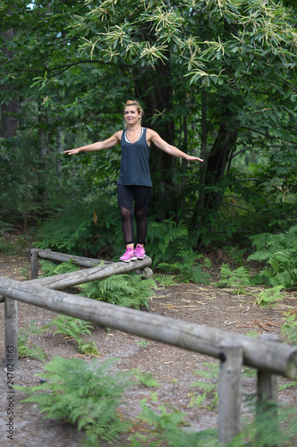 young active woman in a fitness trail