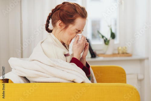 Unwell young woman with a seasonal cold
