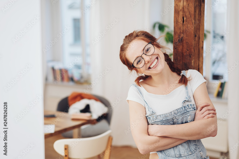 happy confident young woman with folded arms happy confident young woman with folded arms