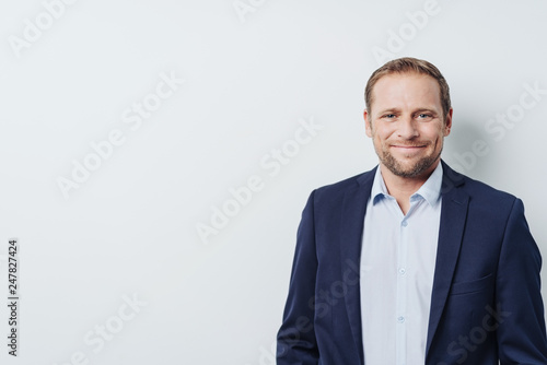 Businessman against white background, copy space
