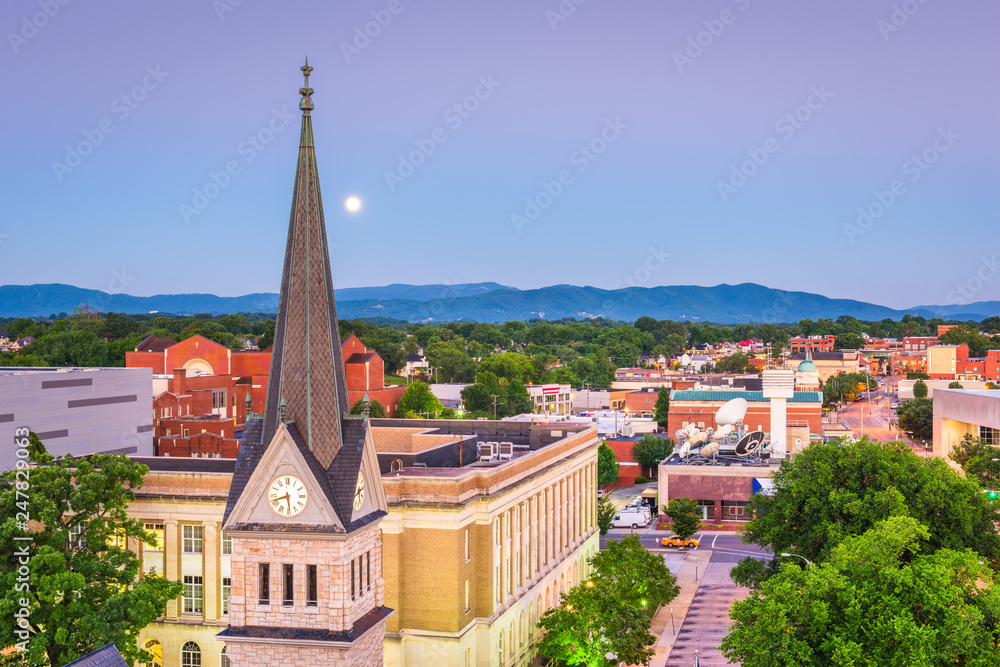 Roanoke, Virginia, USA downtown cityscape and church steeple at dawn.