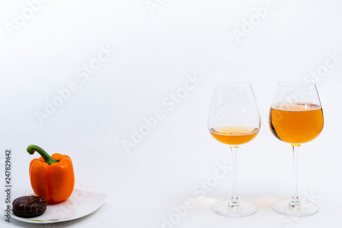 Alcoholic drinks such as wine or beer and variable colorful side dish such as vegetables or fruites surrounded clean white wall for the celebration of anniversary day.