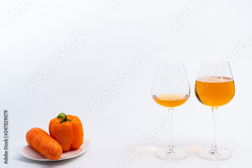 Alcoholic drinks such as wine or beer and variable colorful side dish such as vegetables or fruites surrounded clean white wall for the celebration of anniversary day.