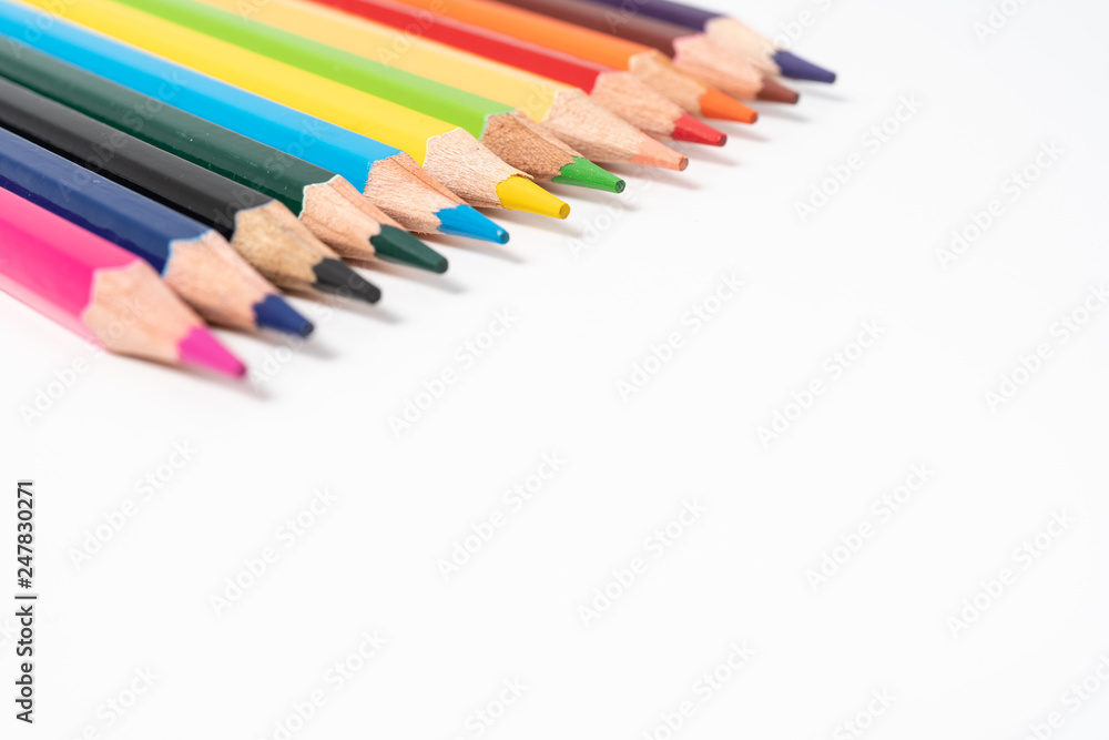 many colored pencils on white background many colored pencils on white background