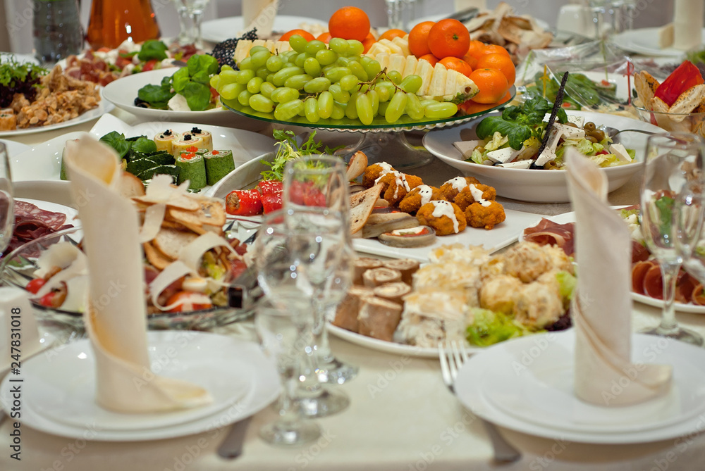 delicious dishes on the table in the restaurant. serving table. delicious dishes on the table in the restaurant. serving table.