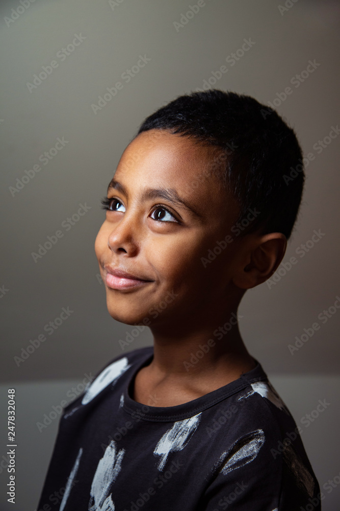 Smiling boy standing indoors