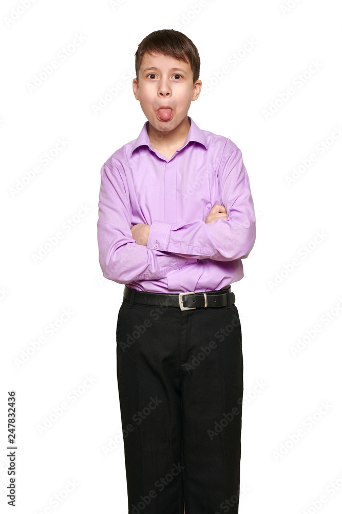 Boy posing on white background, black trousers and purple shirt Boy posing on white background, black trousers and purple shirt
