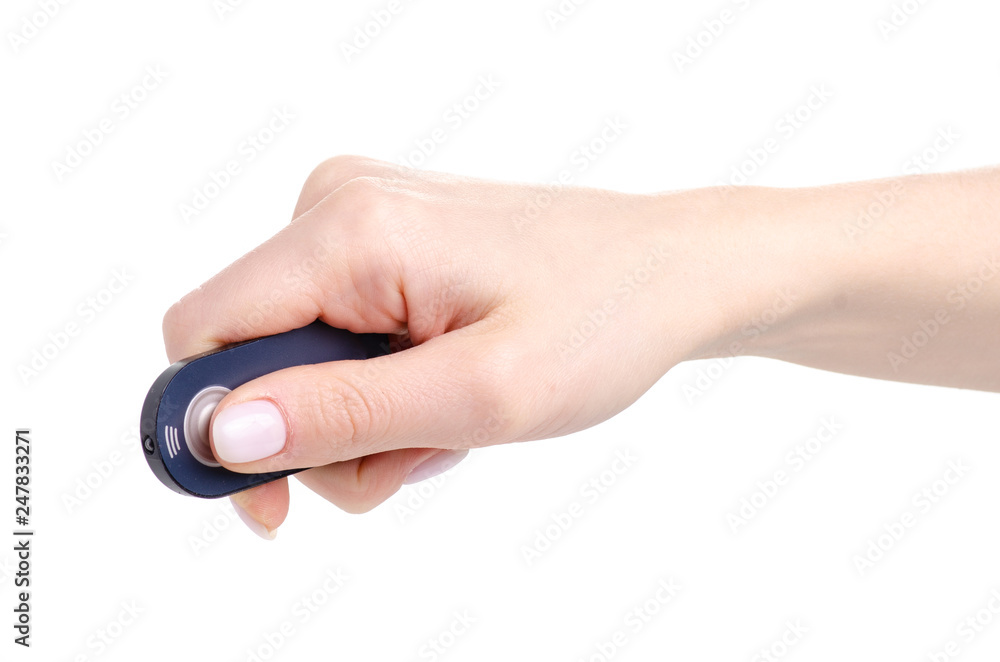 Remote control for the camera in hand on white background isolation Remote control for the camera in hand on white background isolation