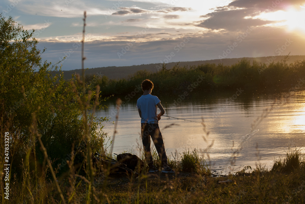 man fishing on the lake