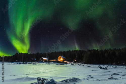 Aurora borealis over the village of Nilmoguba on the White sea coast, Russia