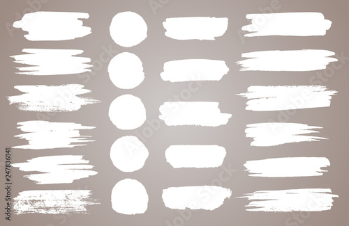 Set of white ink vector stains. Vector black paint, ink brush stroke, brush, line or round texture. Dirty artistic design element, box, frame or background for text.