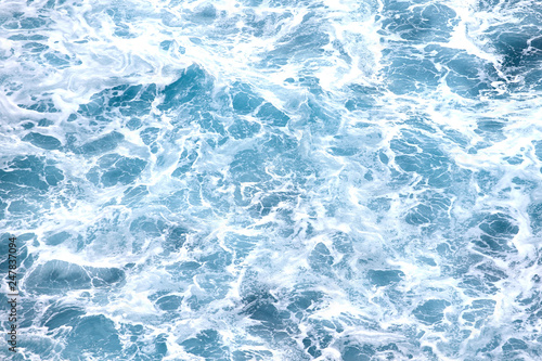 Sea waves with foam, top view, background