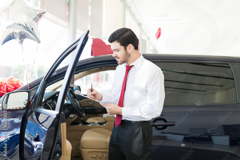 Salesman Working At Dealership Salon Salesman Working At Dealership Salon