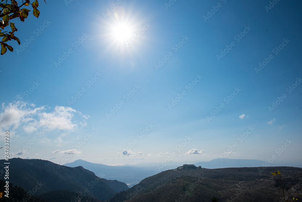 Sunlight view of Parnitha mountain from Bafi refuge in Aharnes, Attiki, Greece