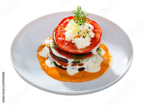 Grilled eggplant and tomatoes stack with spicy sauce