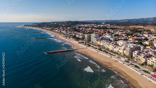 beautiful beach of sitges in Barcelona, Catalonia in a holidays village with a drone aerial picture