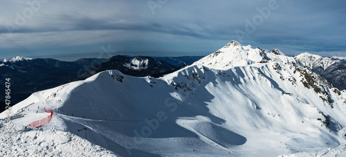 Panoramic view of Aibga mountain ridge (Northern slope) in Rosa Khutor alpine resort. Sochi, Russia. Nature background photo