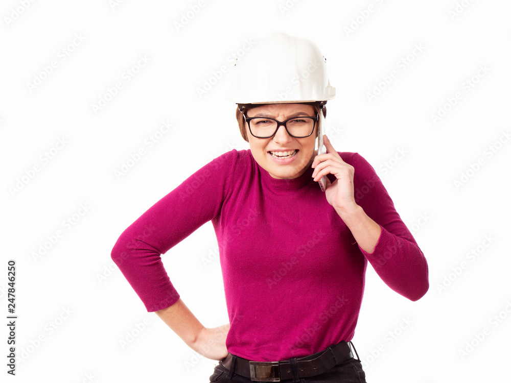Emotional girl brigadier in a white helmet with glasses and a folder in his hands on a white background Emotional girl brigadier in a white helmet with glasses and a folder in his hands on a white background