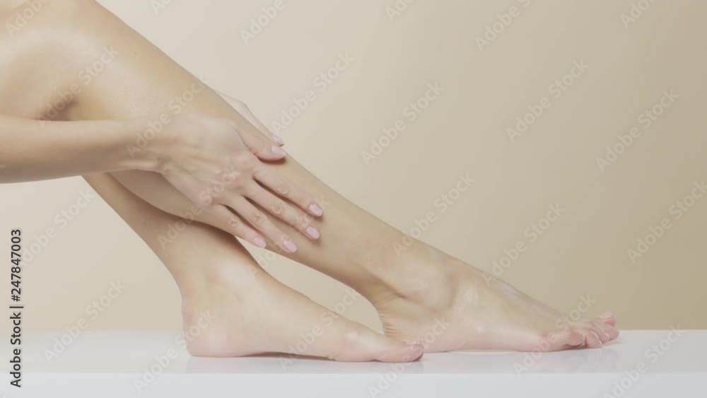 Beautiful female hands massaging legs and feet, recorded at Red Monstro using the light Briese HMI Focus 140. Beautiful female hands massaging legs and feet, recorded at Red Monstro using the light Briese HMI Focus 140.
