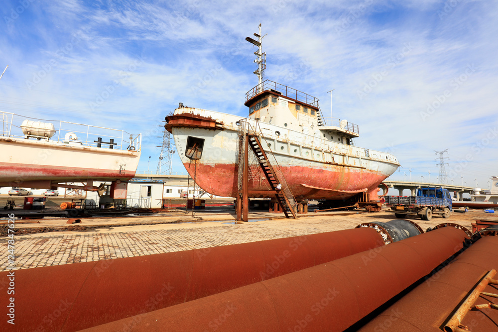 Fototapeta premium ship in repair，in a shipyard, Tangshan City, Hebei, China