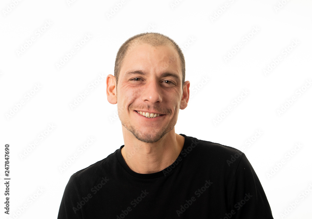 Close up portrait of smiling attractive young man with happy face looking at the camera Close up portrait of smiling attractive young man with happy face looking at the camera