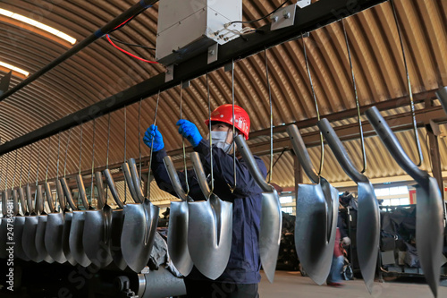 Canvas Print workers in the steel spade production line, in a factory, Tangshan City, Hebei,