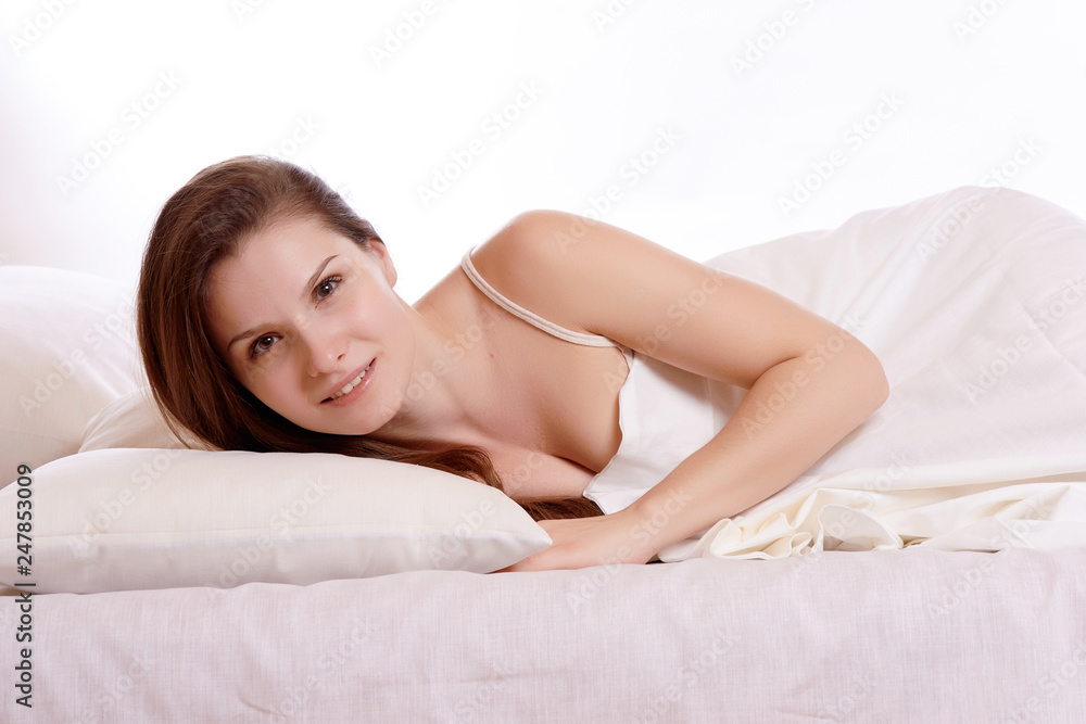 Young beautiful woman sleeping in her bed and relaxing in the morning Young beautiful woman sleeping in her bed and relaxing in the morning