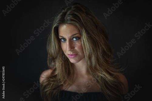 studio portrait of attractive woman