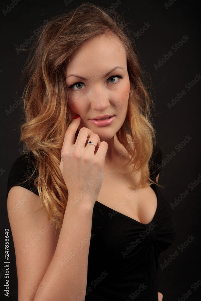 Confident young woman in black dress Confident young woman in black dress