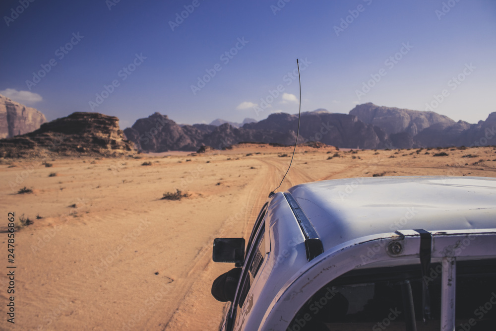 Middle East tourism photography of car tour in Jordan desert scenic landscape background view