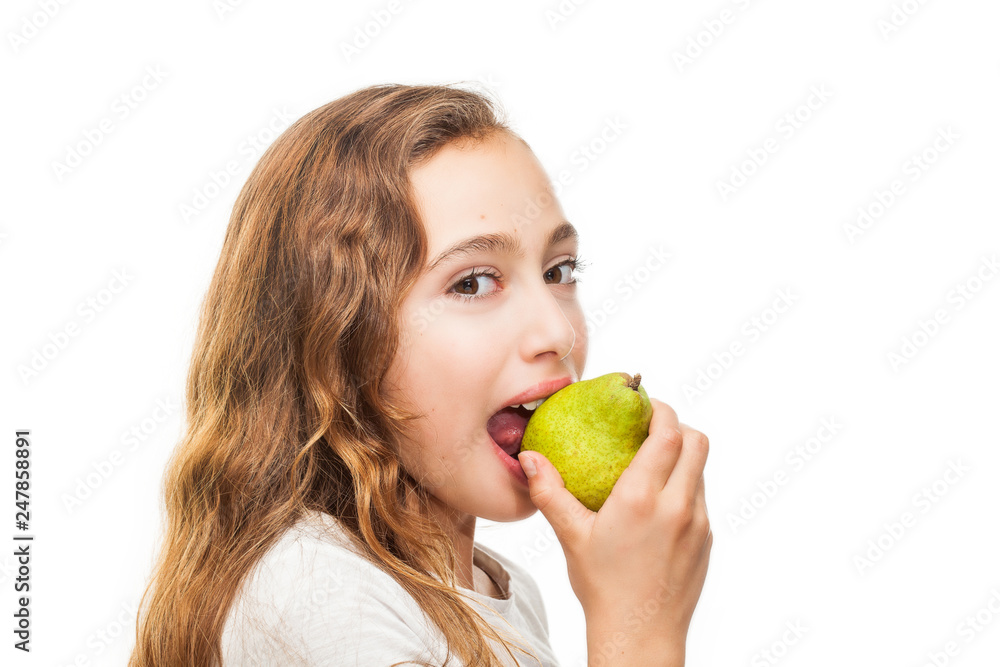 Young girl eating fruit isolated on white background Young girl eating fruit isolated on white background