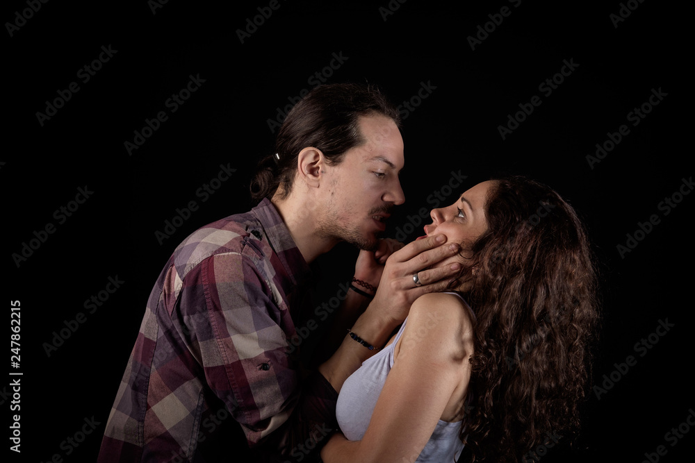 man threatening a scared woman in a gender violence case between a young couple arguing and struggling man threatening a scared woman in a gender violence case between a young couple arguing and struggling