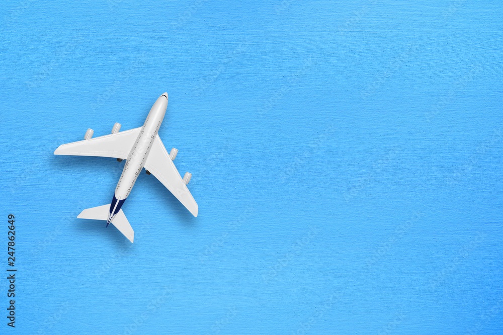 Model of modern plane on blue table Model of modern plane on blue table