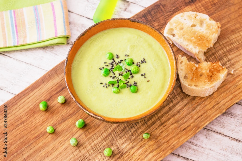 Homemade cream soup with green peas and black sesame seeds Homemade cream soup with green peas and black sesame seeds