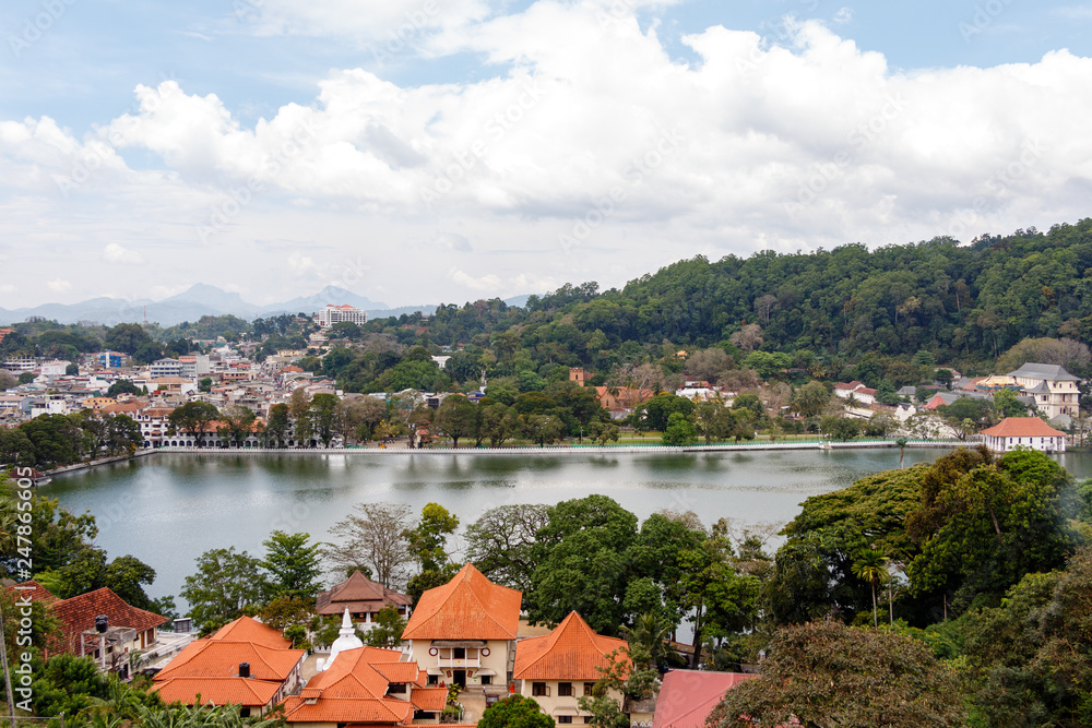 Beautiful panorama view over Kandy, the former capital of Sri Lanka and famous lake on a bright, sunny day. Temple of the Tooth.