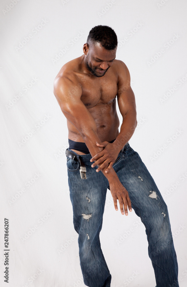 Handsome, shirtless black man looking down Handsome, shirtless black man looking down