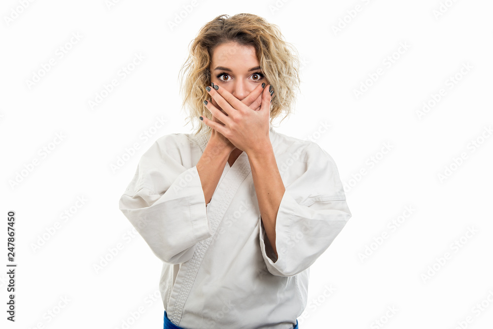 Portrait of female wearing martial arts uniform covering mouth Portrait of female wearing martial arts uniform covering mouth