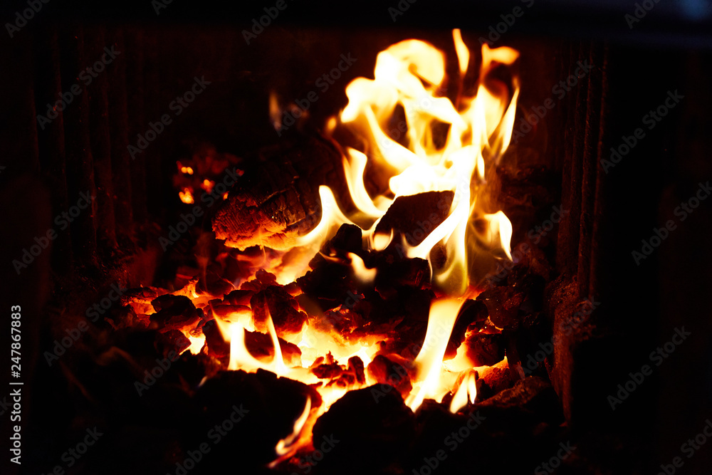 flames of fire in the stove or fireplace in the dark flames of fire in the stove or fireplace in the dark