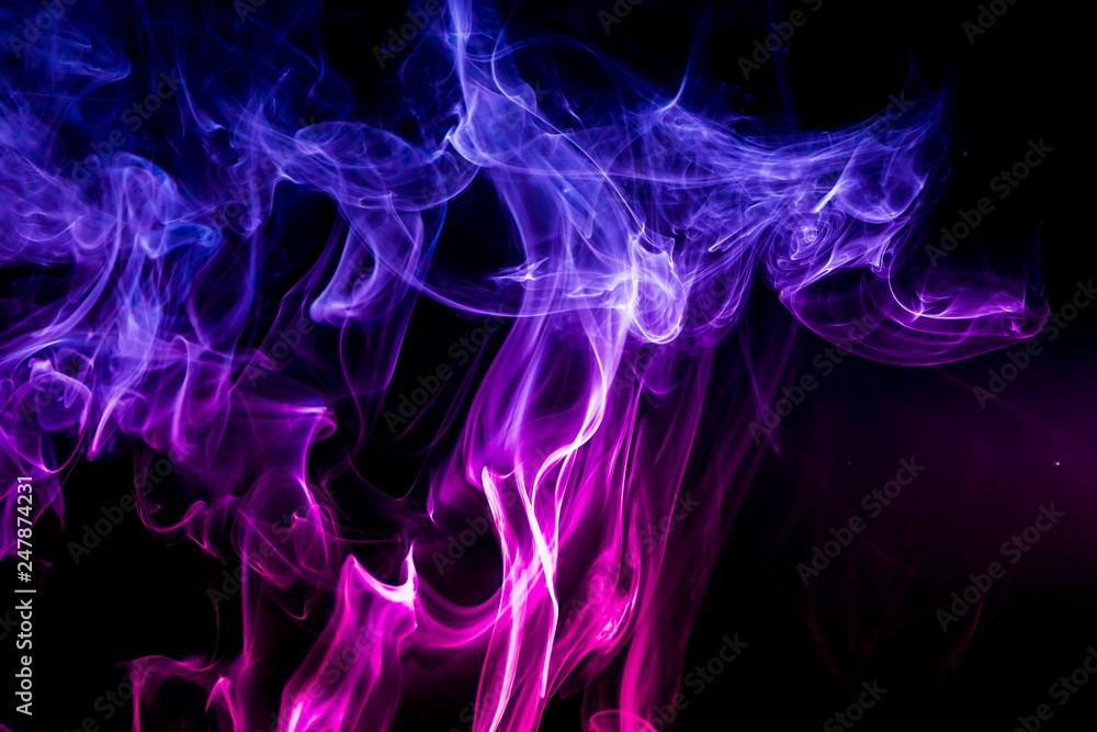 Fototapeta premium Colored smoke on black background