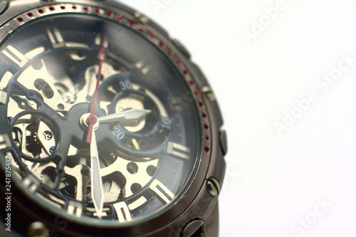 Detailed closeup of watch on white bright background