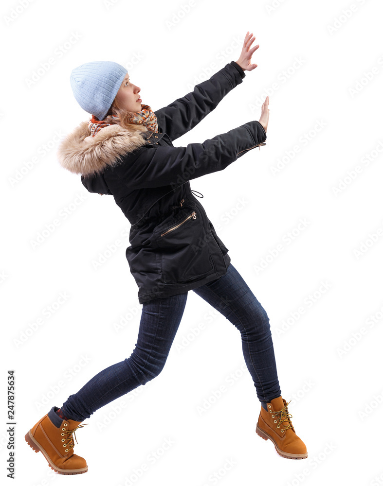 back view of woman pushes wall. back view of woman pushes wall.