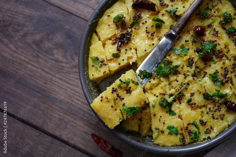 Homemade dhokla - steamed Chickpea flour cake from Gujarat, India Homemade dhokla - steamed Chickpea flour cake from Gujarat, India