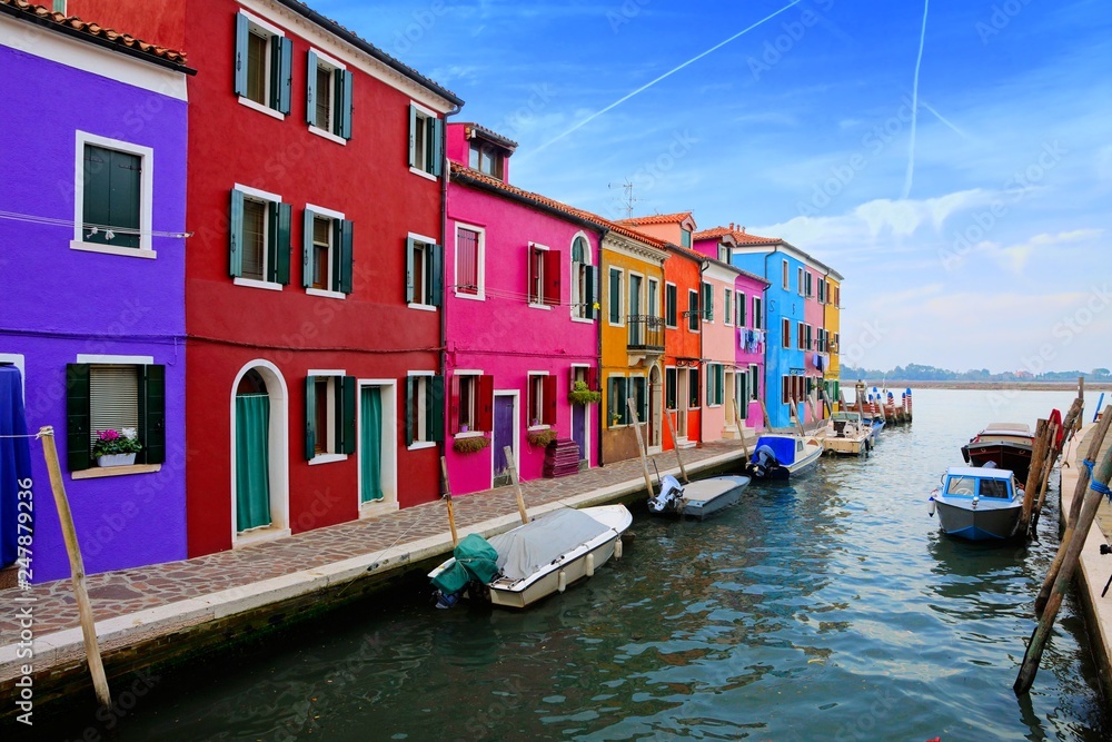 Vibrant houses along a canal on the colorful island of Burano near Venice, Italy