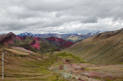 Beautiful view of the colorful Vinicunca valley (rainbow mountain) in a cloudy day. Perú. 