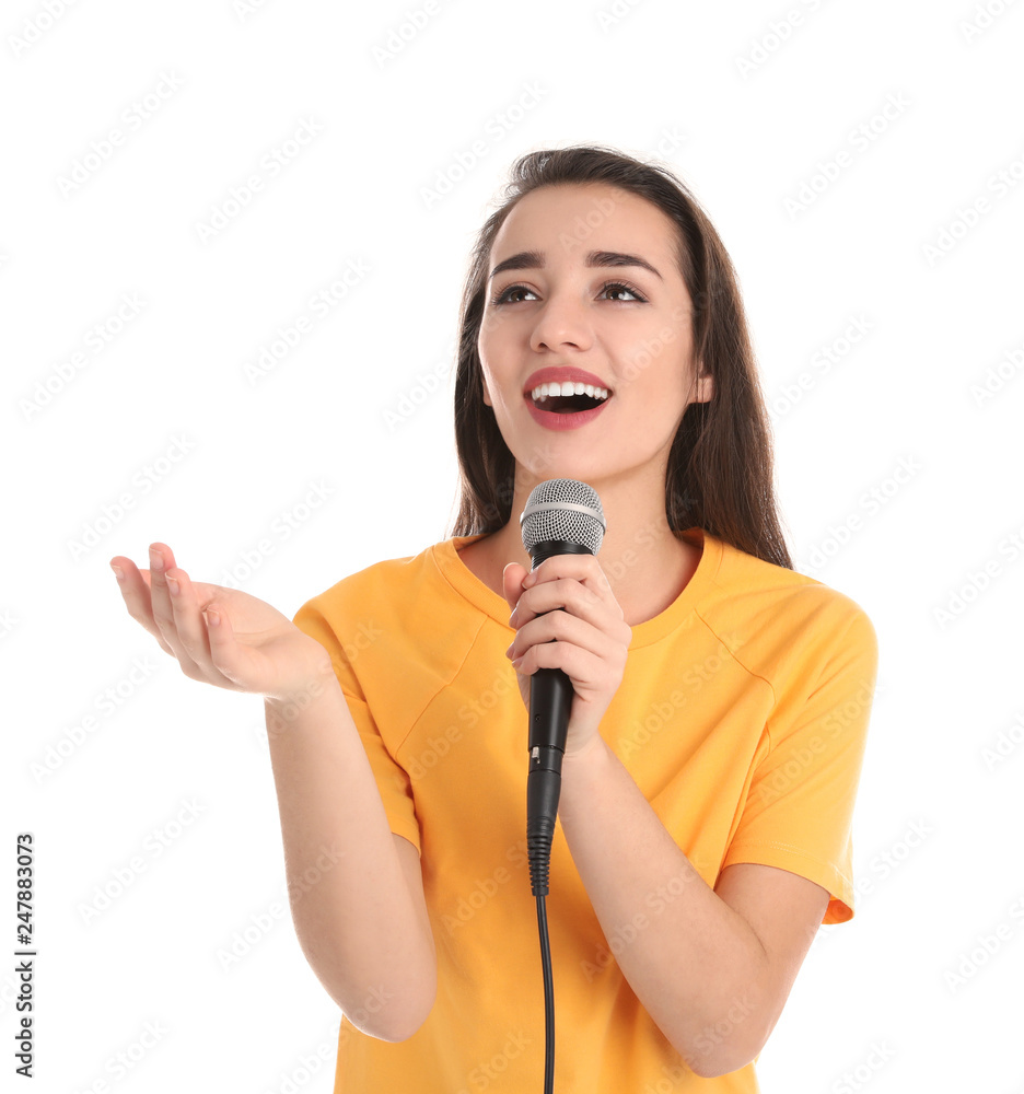 Young woman wearing casual clothes singing in microphone on white background Young woman wearing casual clothes singing in microphone on white background