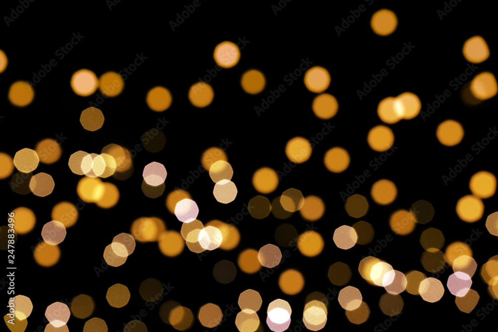 Beautiful golden lights on dark background. Bokeh effect - obrazy, fototapety, plakaty 